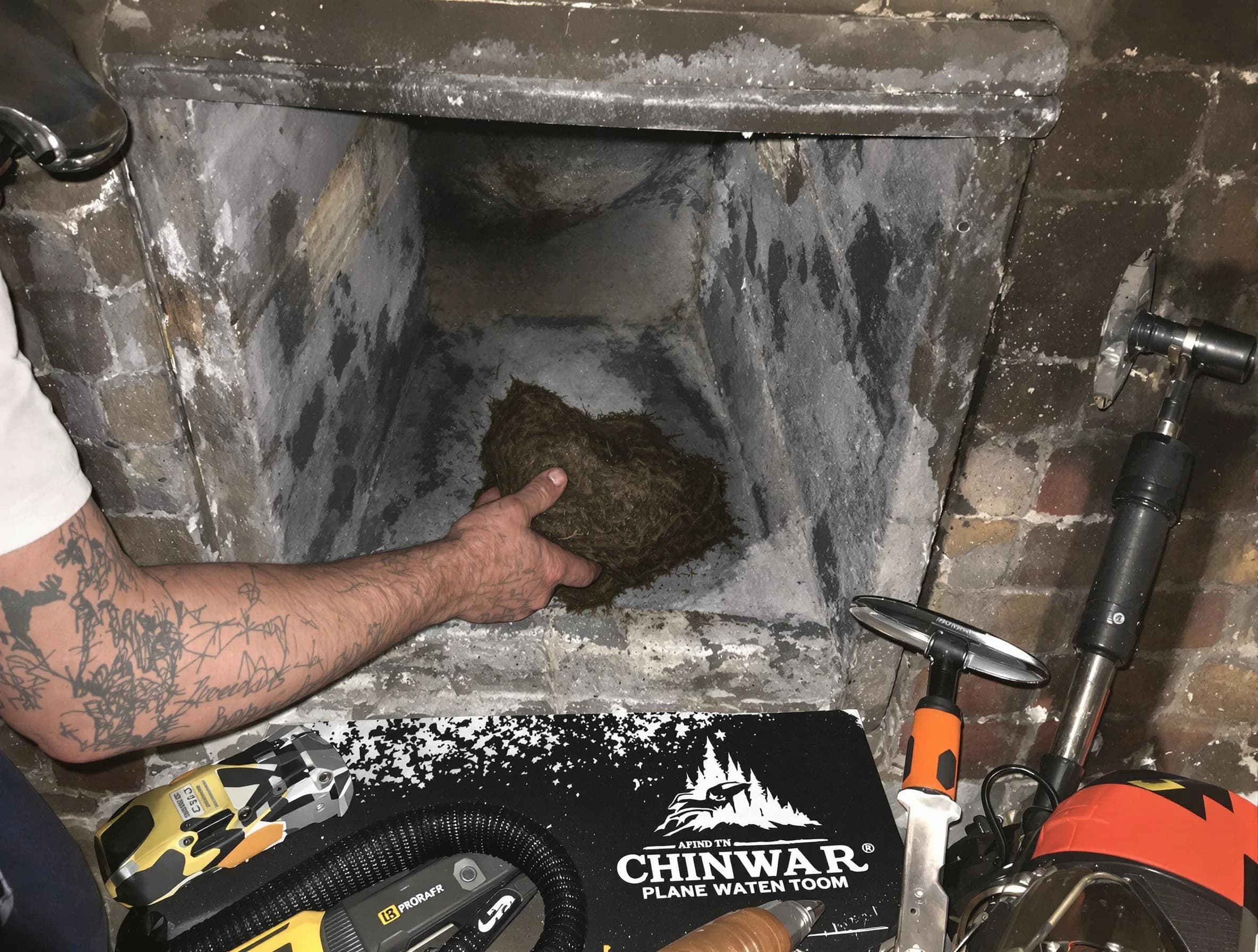 South Fulton Chimney Sweep safely removing debris and screening chimney in South Fulton, GA